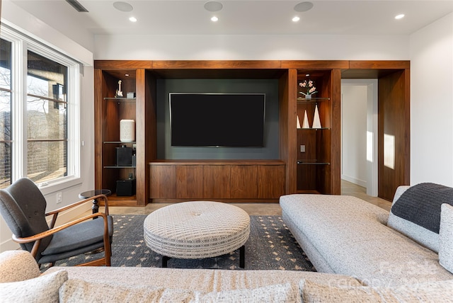 living area featuring recessed lighting and visible vents