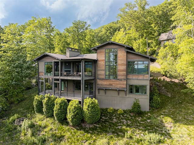 1121 Timberbluff Way, Arden, NC 28704 - rear view of house with a balcony and a chimney