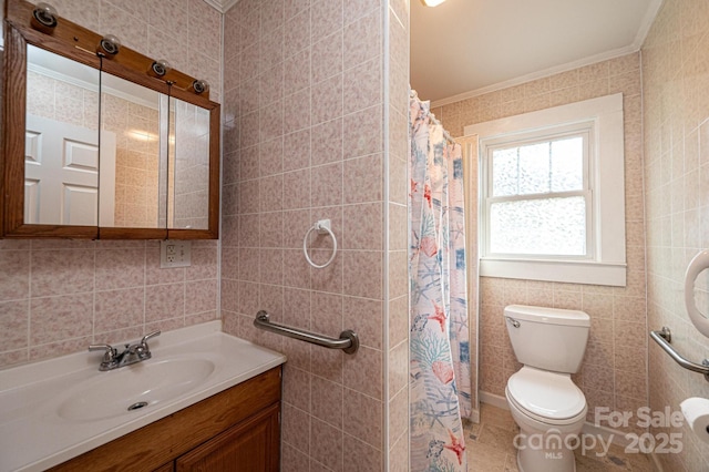 full bathroom featuring toilet, tile walls, crown molding, and vanity