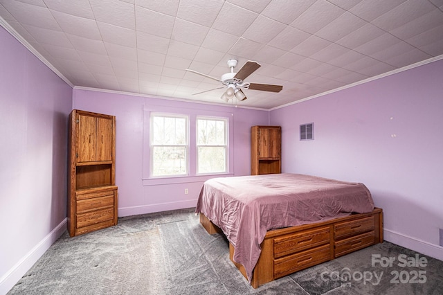 carpeted bedroom featuring baseboards, visible vents, ornamental molding, and a ceiling fan