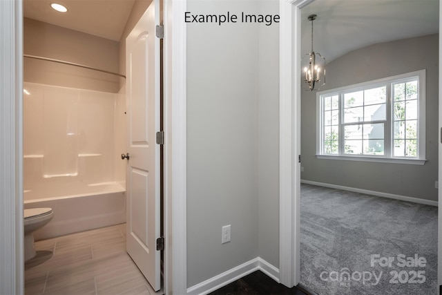full bathroom with toilet, baseboards, a chandelier,  shower combination, and recessed lighting