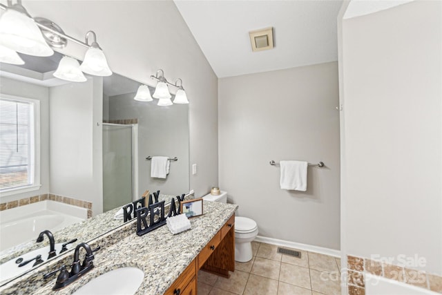 full bathroom featuring visible vents, toilet, a stall shower, vanity, and tile patterned floors