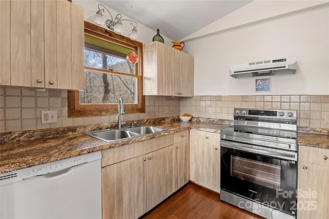 kitchen with stainless steel range with electric stovetop, white dishwasher, under cabinet range hood, light brown cabinets, and a sink