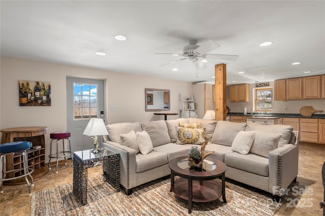 living room with a ceiling fan and recessed lighting