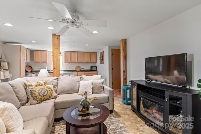 living room featuring ceiling fan and recessed lighting