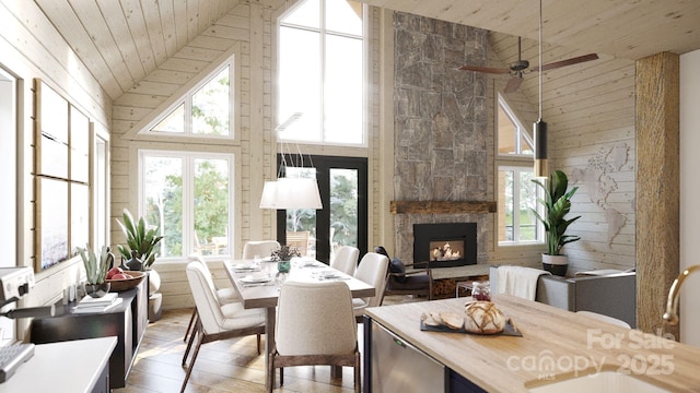 sunroom with vaulted ceiling, sink, wooden ceiling, and a fireplace