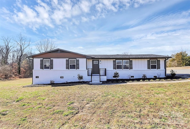 single story home featuring crawl space, a front lawn, and brick siding