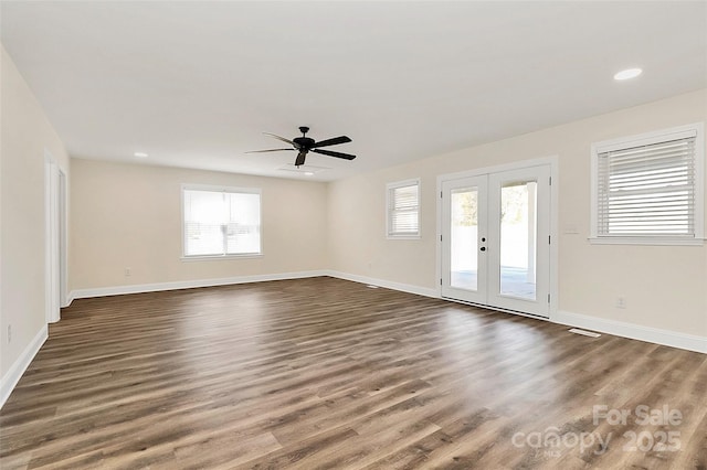 interior space with french doors, recessed lighting, dark wood finished floors, and baseboards