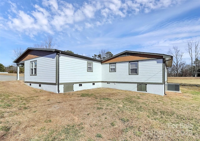 rear view of property with a yard