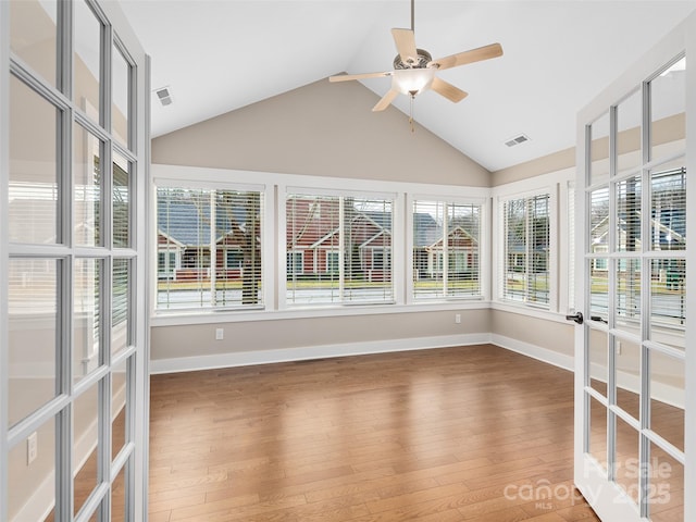 unfurnished sunroom featuring lofted ceiling and ceiling fan