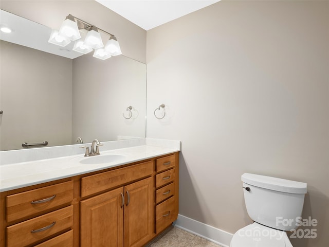 bathroom featuring toilet and vanity