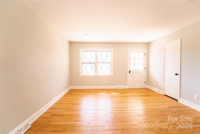 empty room with light wood-type flooring