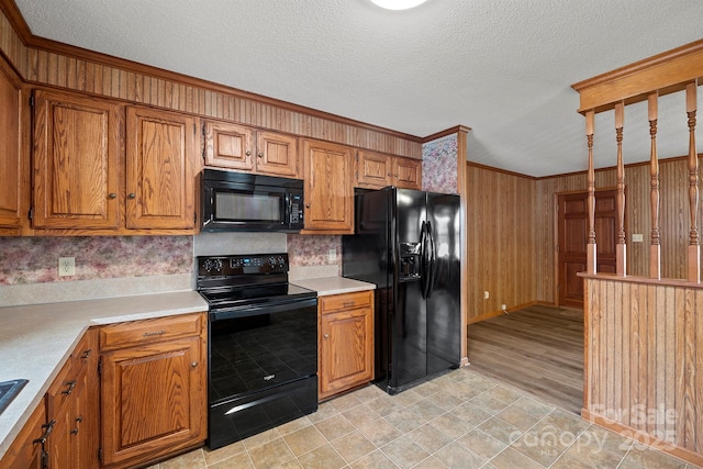 kitchen with brown cabinetry and black appliances