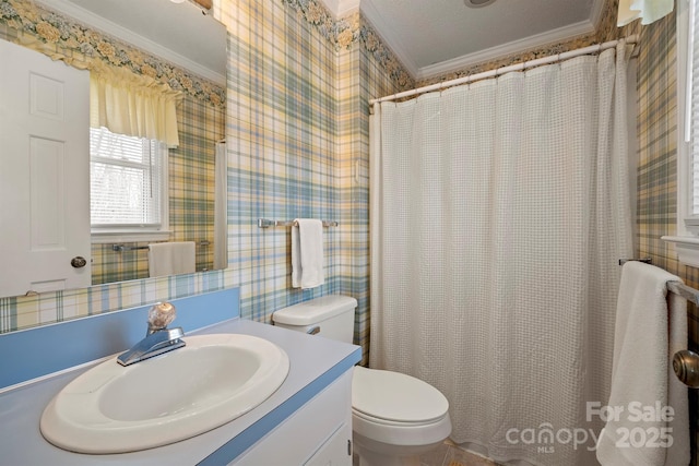 bathroom featuring curtained shower, toilet, ornamental molding, vanity, and wallpapered walls