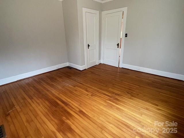 spare room with light hardwood / wood-style floors