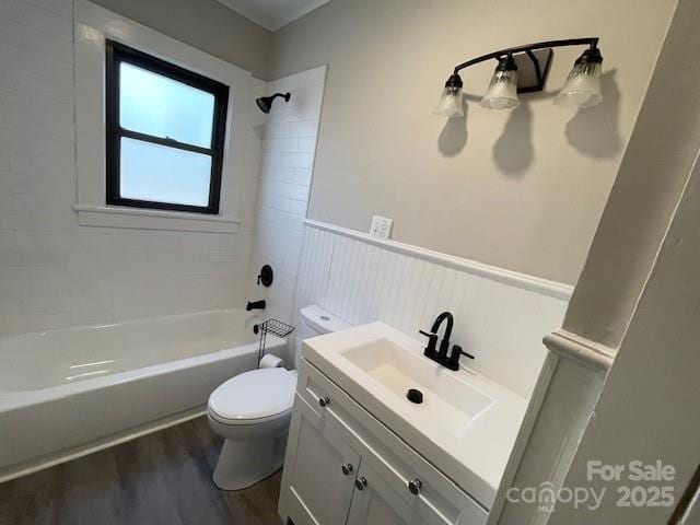 full bathroom with wood-type flooring, vanity, toilet, and tiled shower / bath