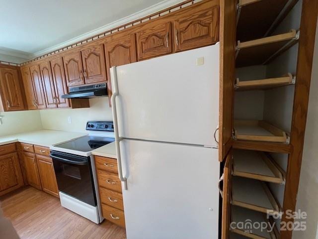 5135 Tucker Ave, Kannapolis, NC 28081 - kitchen featuring freestanding refrigerator, electric range, under cabinet range hood, brown cabinetry, and light wood-type flooring