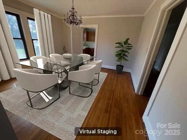 5135 Tucker Ave, Kannapolis, NC 28081 - dining space featuring ornamental molding, wood finished floors, and a chandelier