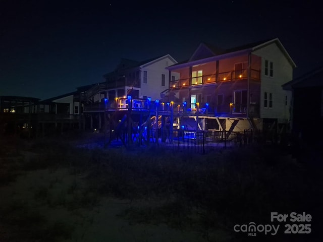 2017 W Beach Dr, Oak Island, NC 28465 - view of back of house at night