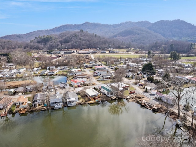 bird's eye view with a water and mountain view