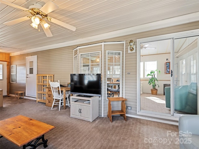 living room with ceiling fan and carpet floors