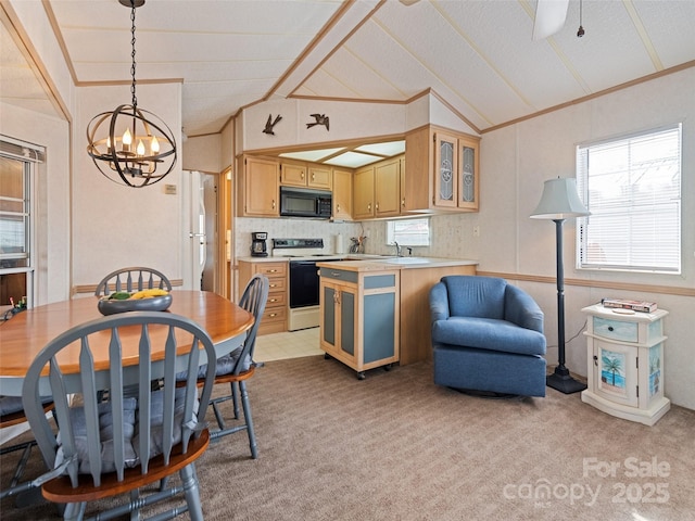 kitchen with pendant lighting, white range with electric cooktop, light colored carpet, and vaulted ceiling