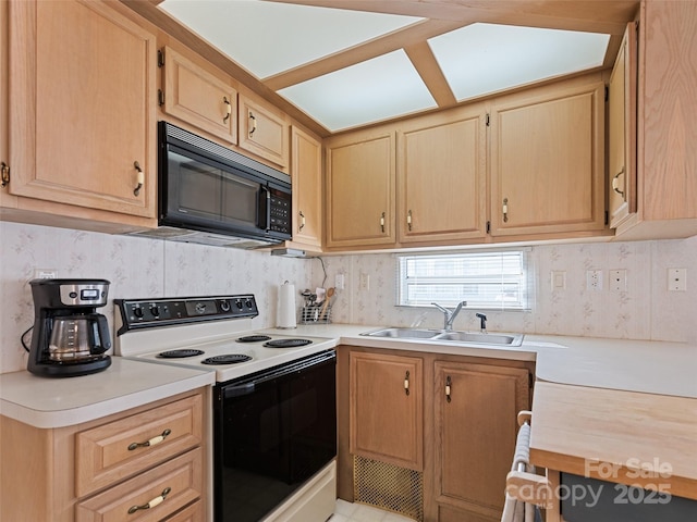 kitchen with electric range oven, sink, and light brown cabinets