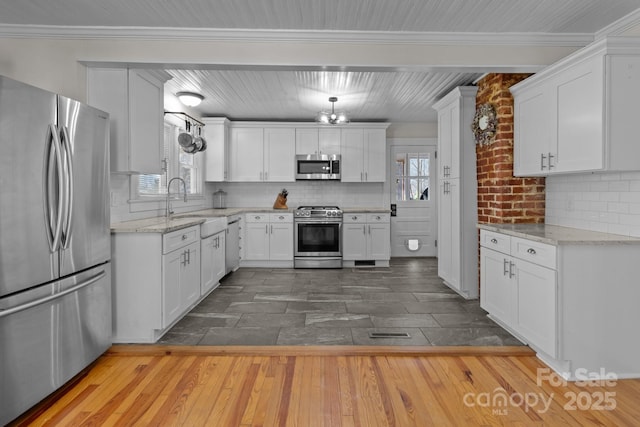 1216 Innis Ave, Kannapolis, NC 28081 - kitchen with a sink, white cabinetry, appliances with stainless steel finishes, and a healthy amount of sunlight
