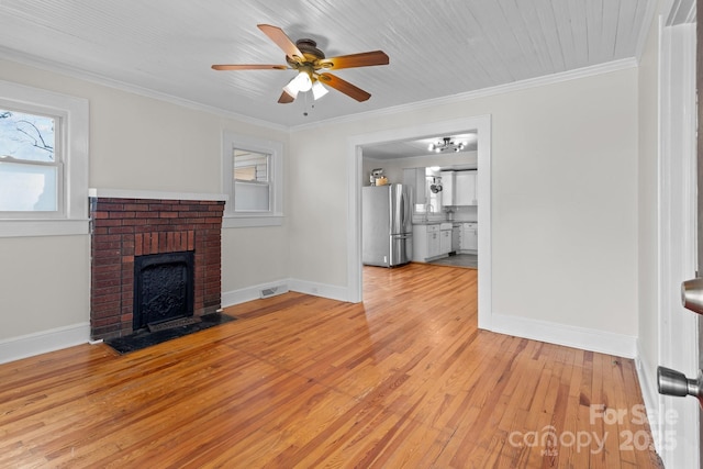 1216 Innis Ave, Kannapolis, NC 28081 - unfurnished living room with visible vents, baseboards, ceiling fan, light wood-type flooring, and ornamental molding