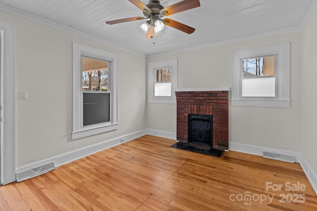 1216 Innis Ave, Kannapolis, NC 28081 - unfurnished living room with crown molding, light wood-style floors, and visible vents