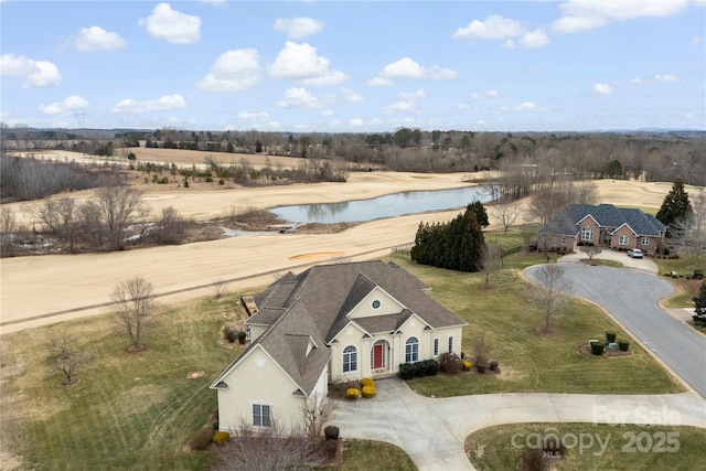 drone / aerial view featuring a water view