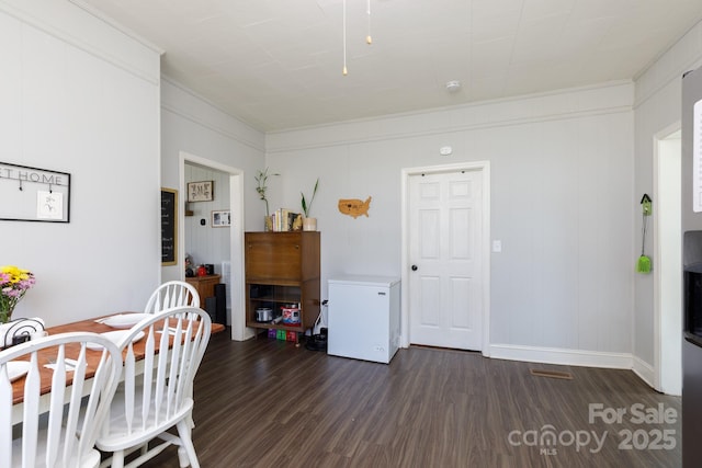 dining room featuring dark hardwood / wood-style flooring