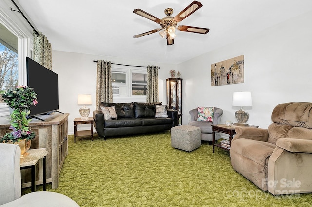 carpeted living room with ceiling fan