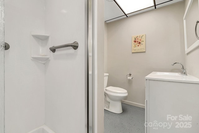 bathroom with vanity, toilet, and walk in shower