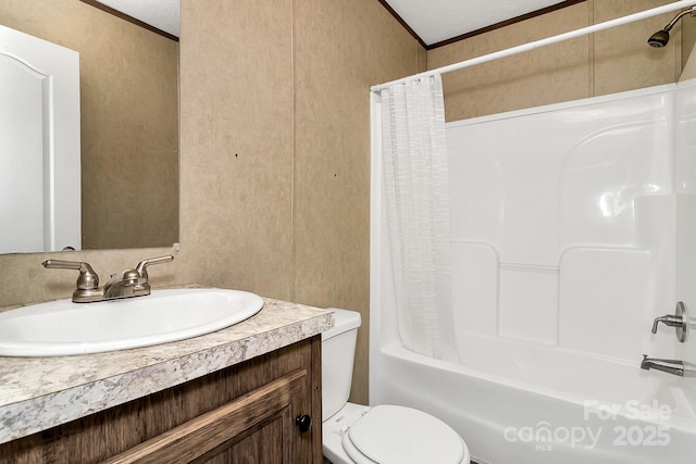 full bathroom featuring ornamental molding, shower / bath combination with curtain, vanity, and toilet