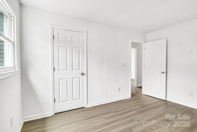 unfurnished bedroom featuring light hardwood / wood-style floors