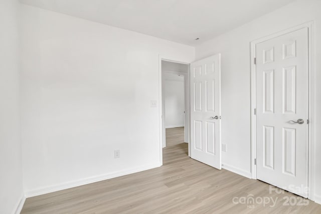 unfurnished bedroom featuring light wood-type flooring