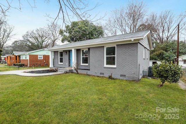 ranch-style home with a front lawn