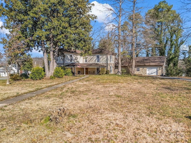 view of front of house with a garage and a front yard