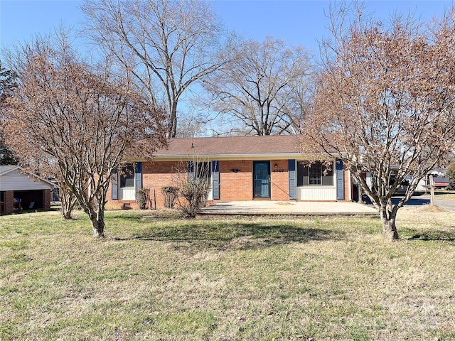 single story home with covered porch, a front yard, and brick siding