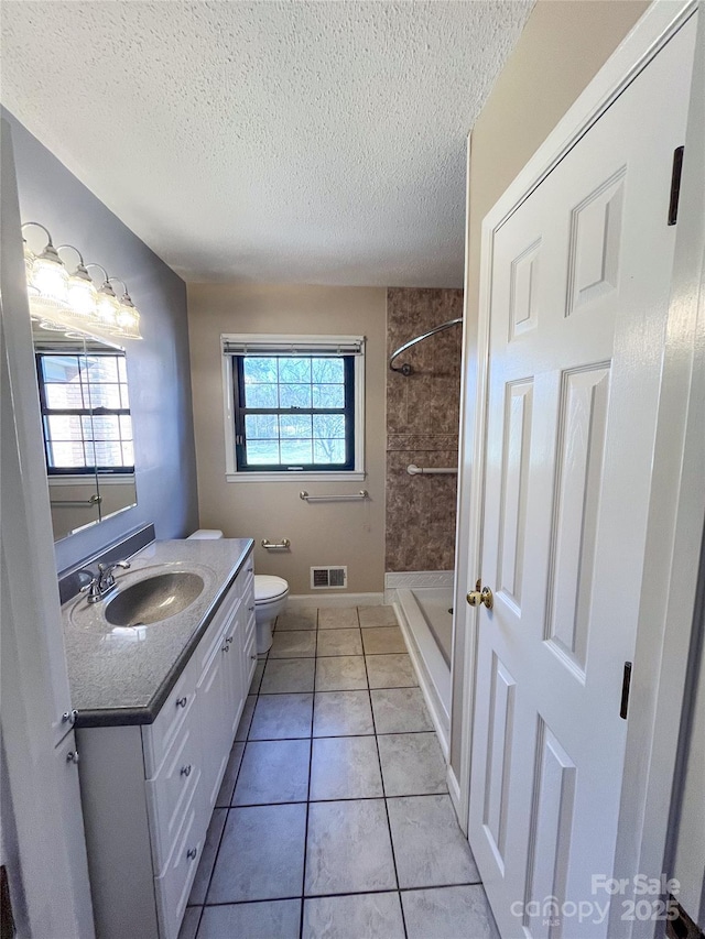 full bathroom with a textured ceiling, tile patterned flooring, visible vents, and a healthy amount of sunlight