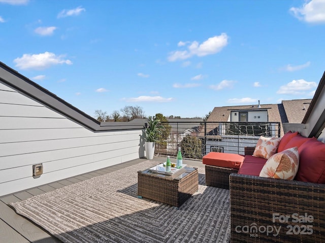 wooden deck featuring an outdoor living space