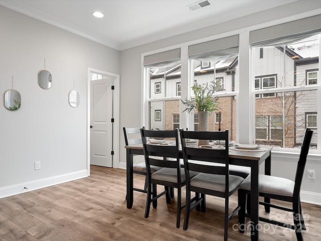 dining area with recessed lighting, visible vents, baseboards, and wood finished floors