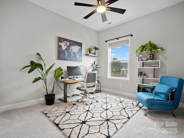 carpeted office space with a ceiling fan, visible vents, and baseboards