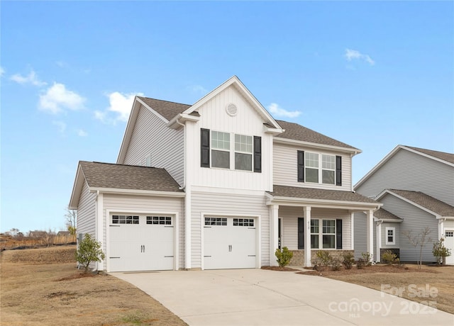 view of front of property with a garage and covered porch