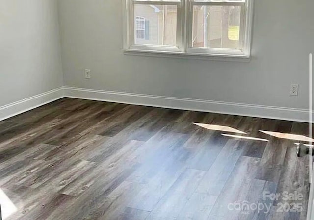 unfurnished room with dark hardwood / wood-style floors