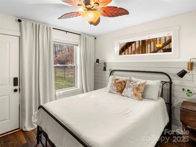 bedroom featuring ceiling fan and dark hardwood / wood-style flooring