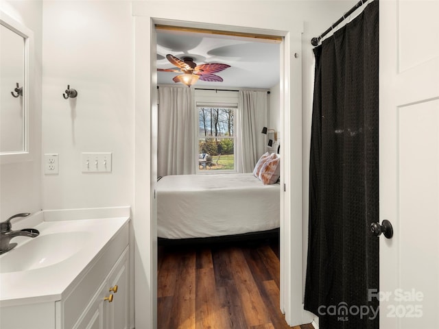 bathroom with vanity, hardwood / wood-style floors, and ceiling fan