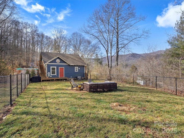 view of yard featuring a mountain view and a pool