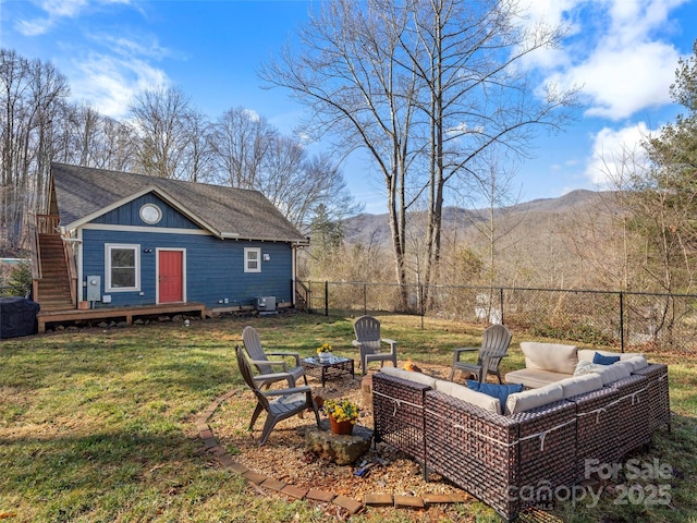 view of yard with a mountain view and an outbuilding